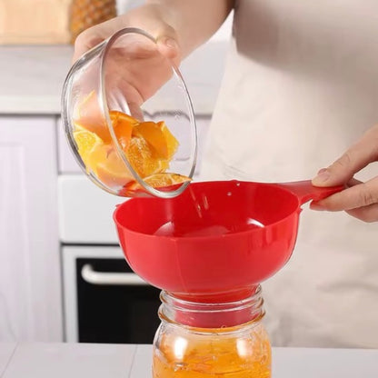 Entonnoir à confiture rouge remplissage propre du bocal 