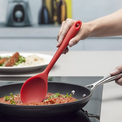 Cuillère outil rouge qui respecte vos casseroles